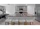 Bright kitchen with a large island, gray cabinets, granite countertops, and stainless steel appliances at 7737 Rosewood Garden Loop, Tampa, FL 33637