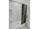 Modern shower with tile surround, handheld sprayer and convenient built-in shelving at 7737 Rosewood Garden Loop, Tampa, FL 33637