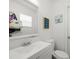 Bathroom features a vanity, toilet, mirror, and decor at 8233 44Th St N N St, Pinellas Park, FL 33781