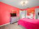 This bright bedroom features bold accent walls and natural light at 8233 44Th St N N St, Pinellas Park, FL 33781