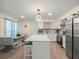 Bright kitchen with stainless steel appliances and white cabinets and center island at 8233 44Th St N N St, Pinellas Park, FL 33781