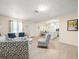 Bright living room with wood floors, neutral color scheme, and stylish furniture at 8233 44Th St N N St, Pinellas Park, FL 33781