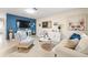Well-decorated living room with a blue accent wall and ample seating at 8233 44Th St N N St, Pinellas Park, FL 33781