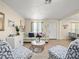 Cozy living room with wood floors, neutral color scheme, and stylish furniture at 8233 44Th St N N St, Pinellas Park, FL 33781