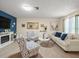 Well-decorated living room with a blue accent wall and ample seating at 8233 44Th St N N St, Pinellas Park, FL 33781