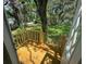 New back porch steps leading to a lush backyard with fence at 9053 Bourbon St, New Port Richey, FL 34654