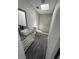 Bathroom with modern fixtures, granite vanity, and a stylish glass-enclosed shower at 9053 Bourbon St, New Port Richey, FL 34654