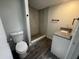 Bathroom showcasing tiled walk-in shower and granite-topped sink at 9053 Bourbon St, New Port Richey, FL 34654