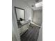 Bathroom featuring granite vanity, stylish sink and glass enclosed shower at 9053 Bourbon St, New Port Richey, FL 34654
