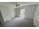 Bedroom with neutral carpet and ceiling fan at 9053 Bourbon St, New Port Richey, FL 34654