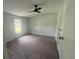 Bedroom with carpet and ceiling fan at 9053 Bourbon St, New Port Richey, FL 34654