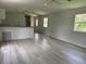 Bright and airy living room featuring durable flooring and modern finishes at 9053 Bourbon St, New Port Richey, FL 34654
