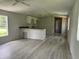 Bright and airy living room featuring durable flooring and modern finishes at 9053 Bourbon St, New Port Richey, FL 34654