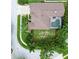Aerial view of home showcasing a private pool, manicured lawn, and well-maintained landscaping at 10675 Park Place Dr, Largo, FL 33778