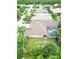 Birds-eye view of a home featuring screened pool, landscaping and a view of the neighborhood at 10675 Park Place Dr, Largo, FL 33778