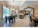 Bright dining area with views of the pool, seamlessly connected to the kitchen at 10675 Park Place Dr, Largo, FL 33778