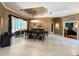 Dining area overlooking screened patio with a large table and bar chairs at 10675 Park Place Dr, Largo, FL 33778