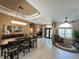 Dining area with tray ceiling, chandelier, and tile floors at 10675 Park Place Dr, Largo, FL 33778