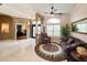 Inviting foyer featuring tile floors, neutral walls, and a cozy seating area with natural light at 10675 Park Place Dr, Largo, FL 33778