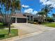 Charming single Gathering home featuring a three car garage and beautiful landscaping at 10675 Park Place Dr, Largo, FL 33778
