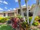Beautiful home with a three car garage and manicured landscaping at 10675 Park Place Dr, Largo, FL 33778