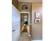 Hallway with tile floors and access to other rooms in the home at 10675 Park Place Dr, Largo, FL 33778
