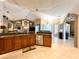 Open-concept kitchen boasts granite counters, stainless appliances, and seamless flow to other living areas at 10675 Park Place Dr, Largo, FL 33778
