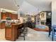 Inviting kitchen open to the living room, featuring a breakfast bar and modern appliances at 10675 Park Place Dr, Largo, FL 33778