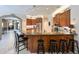 Modern kitchen featuring granite countertops, track lighting, and stainless steel appliances at 10675 Park Place Dr, Largo, FL 33778
