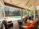 View of the lanai with a pool and outdoor seating area at 10675 Park Place Dr, Largo, FL 33778