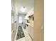 Functional laundry room with modern appliances, storage cabinets, and a utility sink at 10675 Park Place Dr, Largo, FL 33778