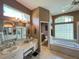 Spacious bathroom featuring a soaking tub, dual sinks, and a glass-enclosed shower at 10675 Park Place Dr, Largo, FL 33778