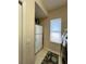 Pantry and laundry area featuring a modern refrigerator, ample storage, and natural light at 10675 Park Place Dr, Largo, FL 33778