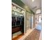 Walk-in closet with mirror doors and access to the main bathroom at 10675 Park Place Dr, Largo, FL 33778