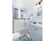 Bright bathroom featuring a vanity, tub-shower with accent tile, and updated fixtures, offering a clean, modern design at 112 E Plymouth St, Tampa, FL 33603