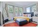 Bright bedroom with a comfortable bed, a large mirror, and a cozy atmosphere at 112 E Plymouth St, Tampa, FL 33603