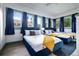 Bright bedroom featuring two cozy beds, ample natural light, and stylish decor at 112 E Plymouth St, Tampa, FL 33603