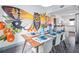 Open-concept dining area showcasing a large mural and seamless flow into the adjacent kitchen at 112 E Plymouth St, Tampa, FL 33603