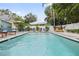 Sparkling pool surrounded by lush landscaping and comfortable lounging areas at 112 E Plymouth St, Tampa, FL 33603