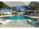 Beautiful backyard pool area with lounge chairs and a covered outdoor bar at 112 E Plymouth St, Tampa, FL 33603
