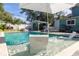 Beautiful backyard pool area with lounge chairs and a covered outdoor bar at 112 E Plymouth St, Tampa, FL 33603