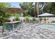 Beautiful pool area with ample seating, lush greenery, and a relaxing ambiance at 112 E Plymouth St, Tampa, FL 33603