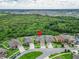 A charming, tan-colored single-Gathering home featuring a pristine yard and surrounded by lush greenery at 11911 Sunburst Marble Rd, Riverview, FL 33579