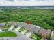 A charming, tan-colored single-Gathering home featuring a pristine yard and surrounded by lush greenery at 11911 Sunburst Marble Rd, Riverview, FL 33579