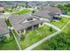 Backyard view of the property featuring a screened-in porch and a white vinyl fence, perfect for outdoor enjoyment at 11911 Sunburst Marble Rd, Riverview, FL 33579