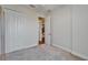 Carpeted bedroom has an access door to other parts of the house and a closet at 11911 Sunburst Marble Rd, Riverview, FL 33579