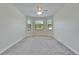 Bedroom featuring neutral colored carpet, a ceiling fan, and a bay window allowing lots of natural light at 11911 Sunburst Marble Rd, Riverview, FL 33579