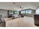 Spacious bonus room featuring plush carpeting, a ceiling fan, and natural lighting at 11911 Sunburst Marble Rd, Riverview, FL 33579