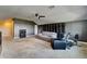 Large bonus room featuring ample space, plush carpeting, and storage shelves at 11911 Sunburst Marble Rd, Riverview, FL 33579