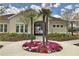 Community clubhouse featuring colorful landscaping and inviting entrance at 11911 Sunburst Marble Rd, Riverview, FL 33579